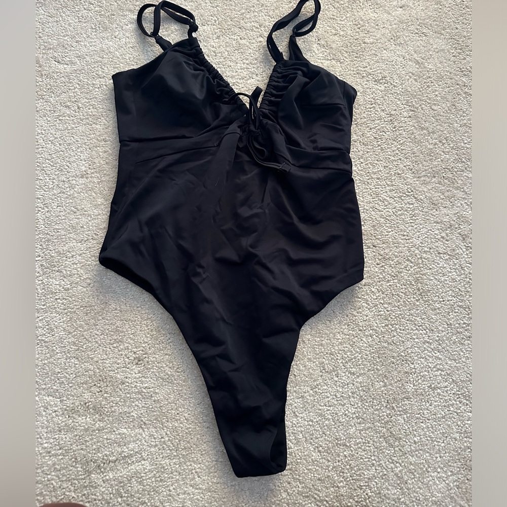 Black one piece swim with adjustable straps